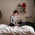 Oil-filled space heater warming a cozy bedroom