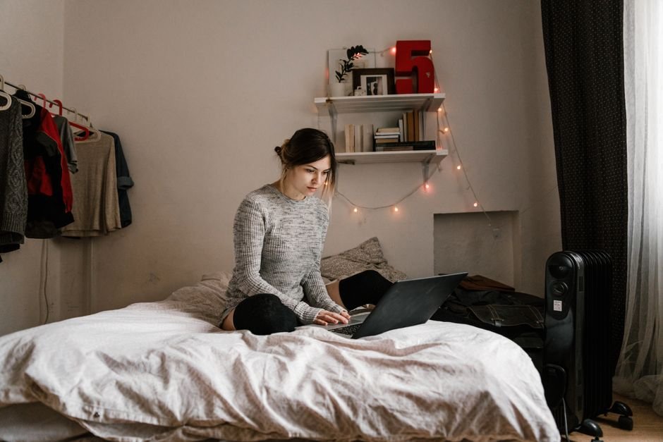 Oil-filled space heater warming a cozy bedroom