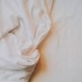 Fresh soft bed sheets on a comfortable bed