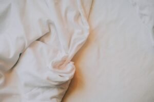 Fresh soft bed sheets on a comfortable bed