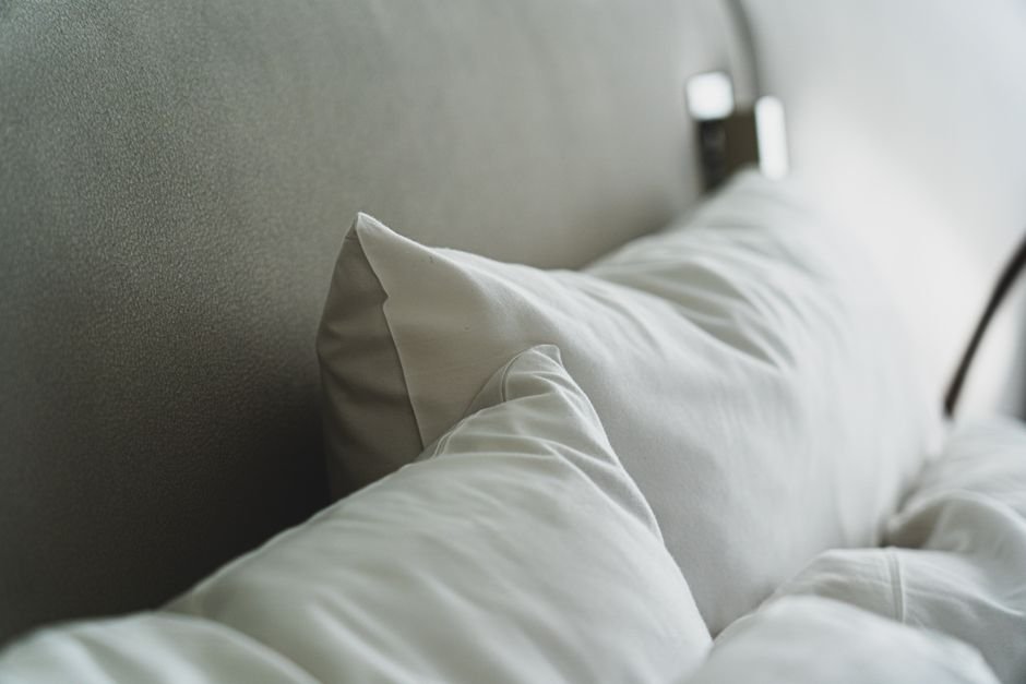 Comfortable pillows arranged on a cozy bed for better sleep