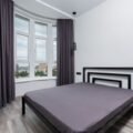 Blackout curtains keeping a cozy bedroom dark for better sleep