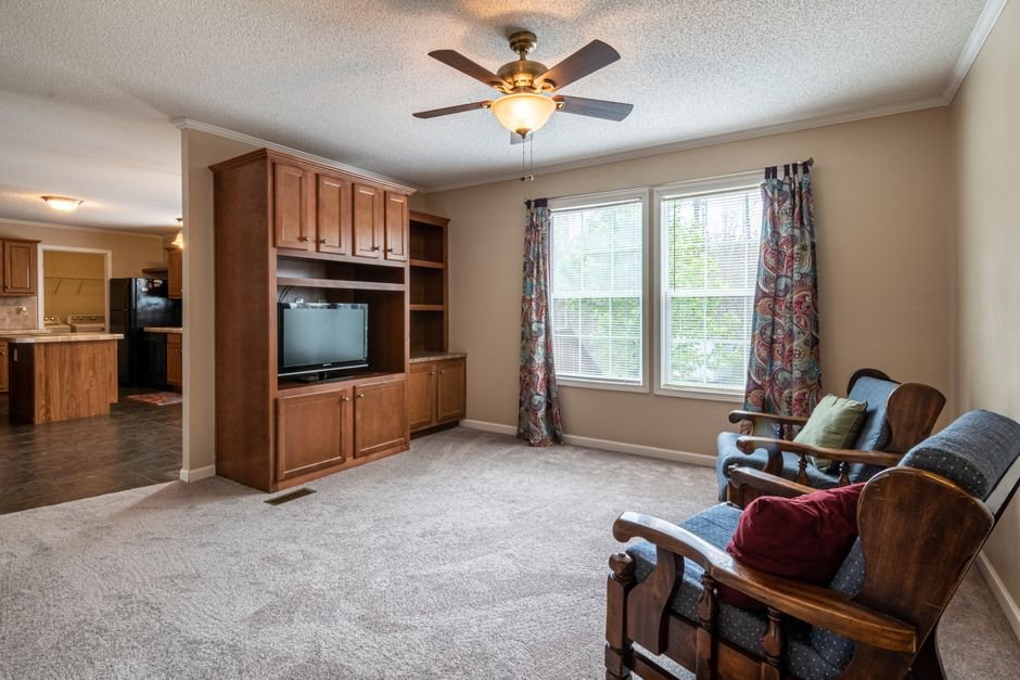 Family room with a five-blade ceiling fan and light kit