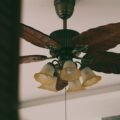 Ornate ceiling fan with a warm light kit