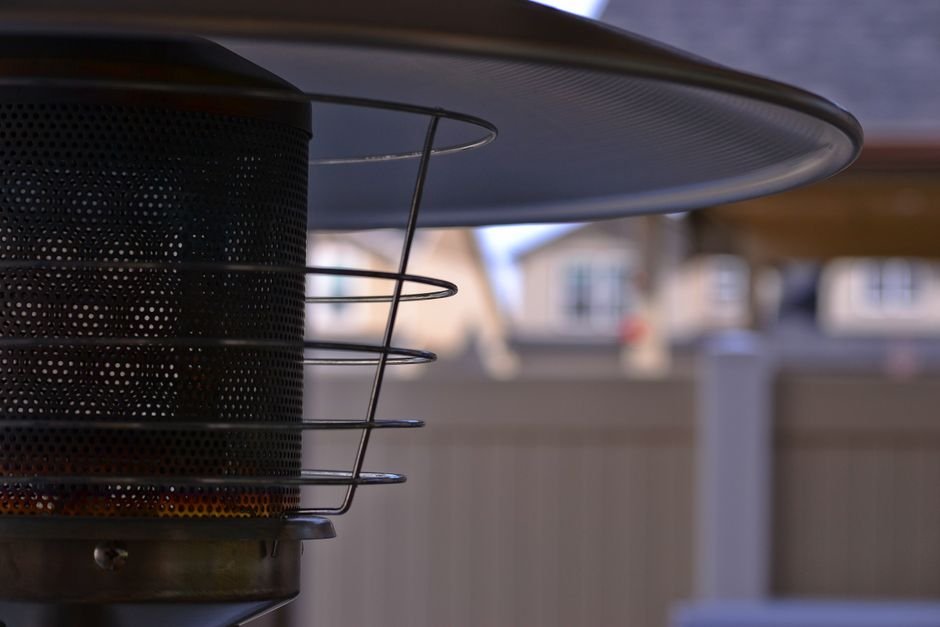 Outdoor propane patio heater warming a covered patio