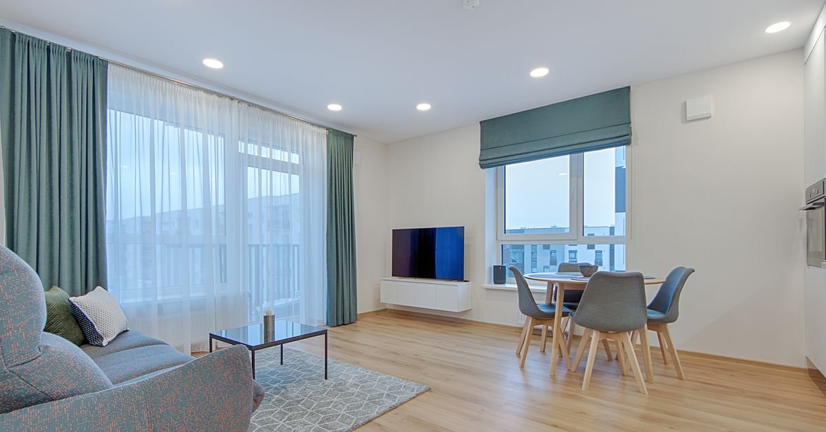 Modern living room with curtains floating just above the floor
