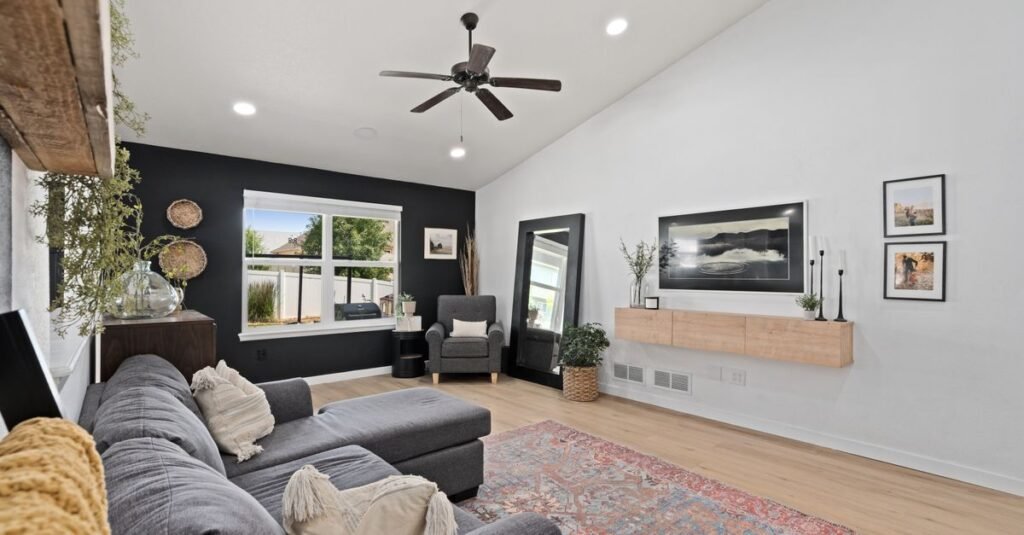 Living room with a properly sized area rug under the sectional Living room with a properly sized area rug under the sectional