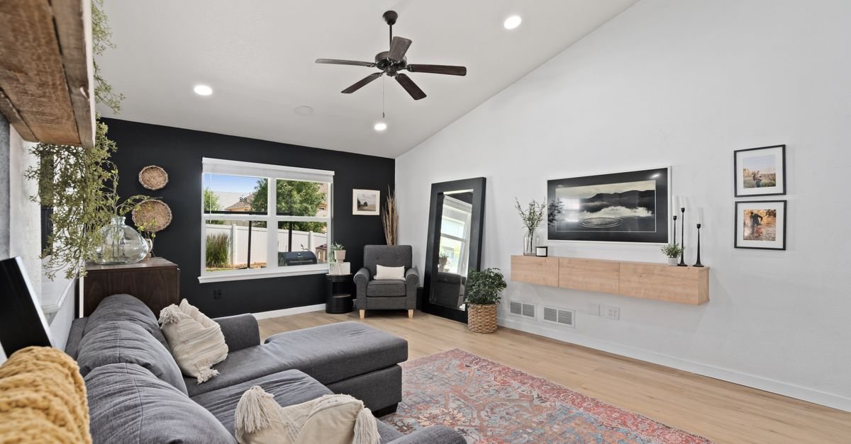 A ceiling fan on a sloped, vaulted ceiling