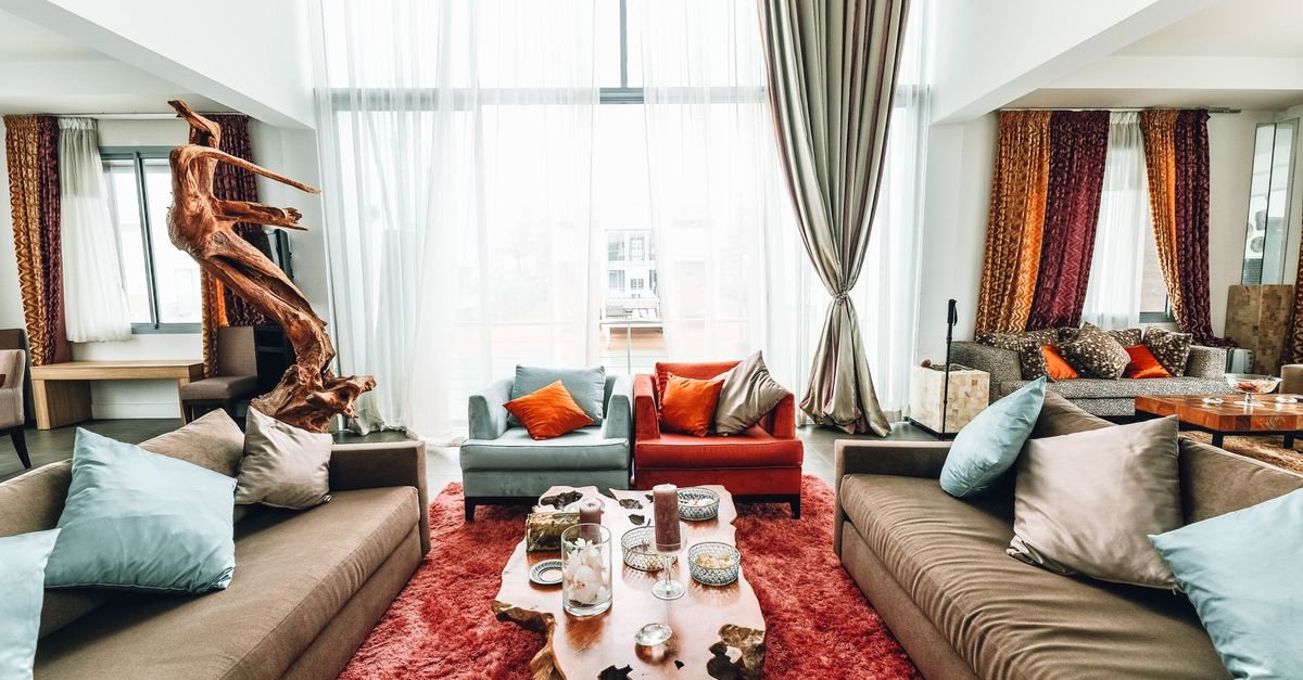 Spacious living room unified by a large area rug