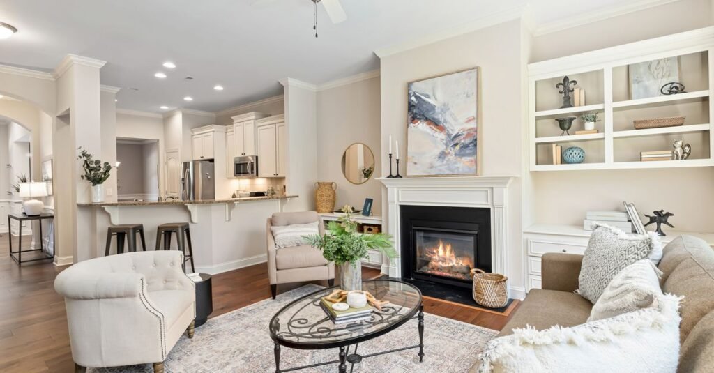 A bright living room with styled built-in shelves beside a fireplace A bright living room with styled built-in shelves beside a fireplace