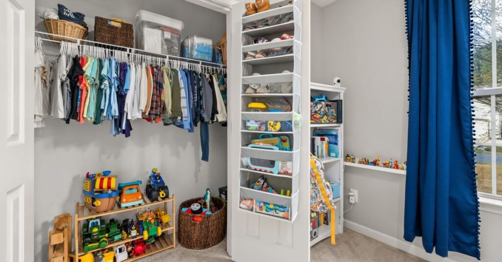 Organized kids closet with toy shelves and bins