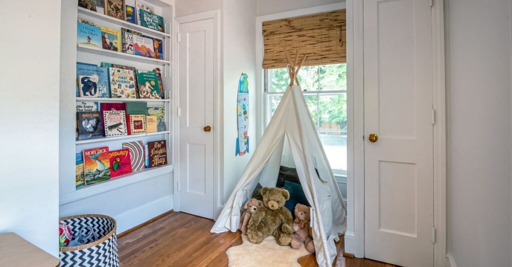 Front-facing book ledges beside a play teepee