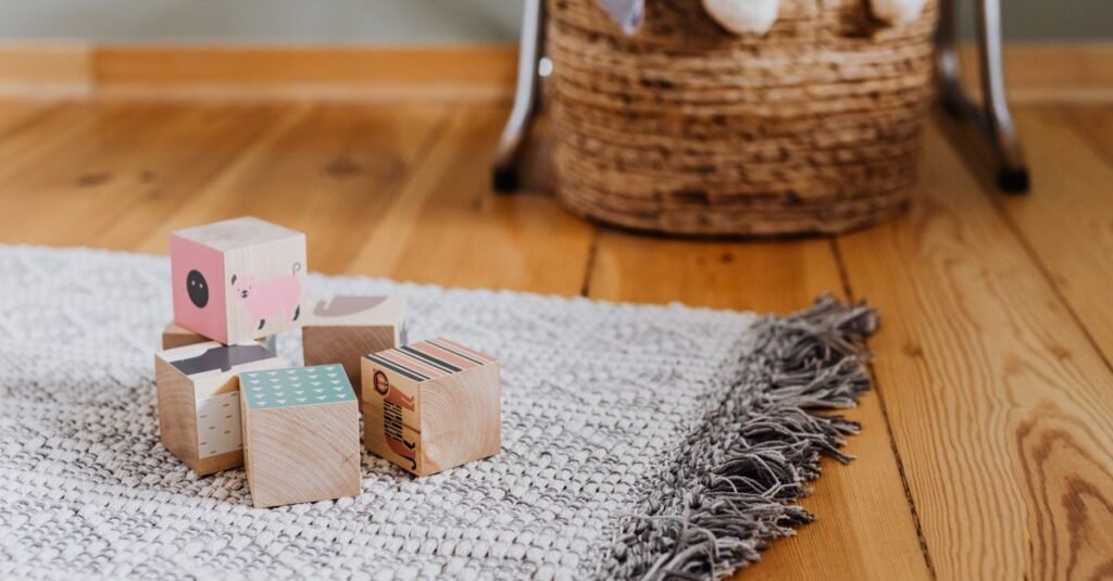 Wooden blocks and a woven basket on the floor