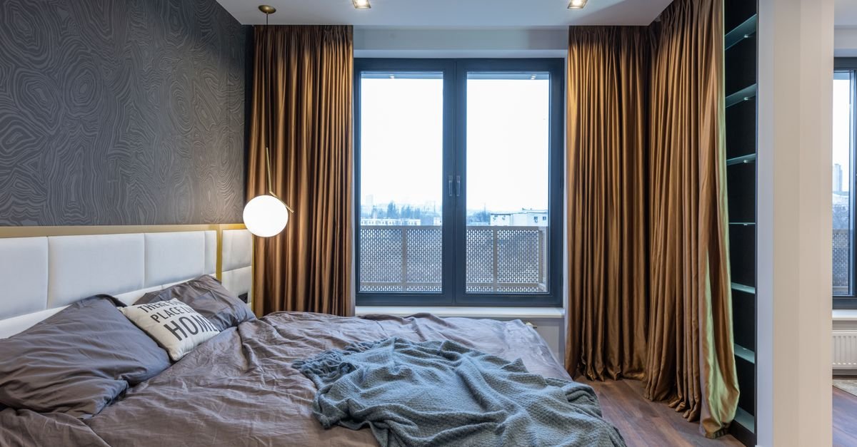 Curtains framing a bedroom window