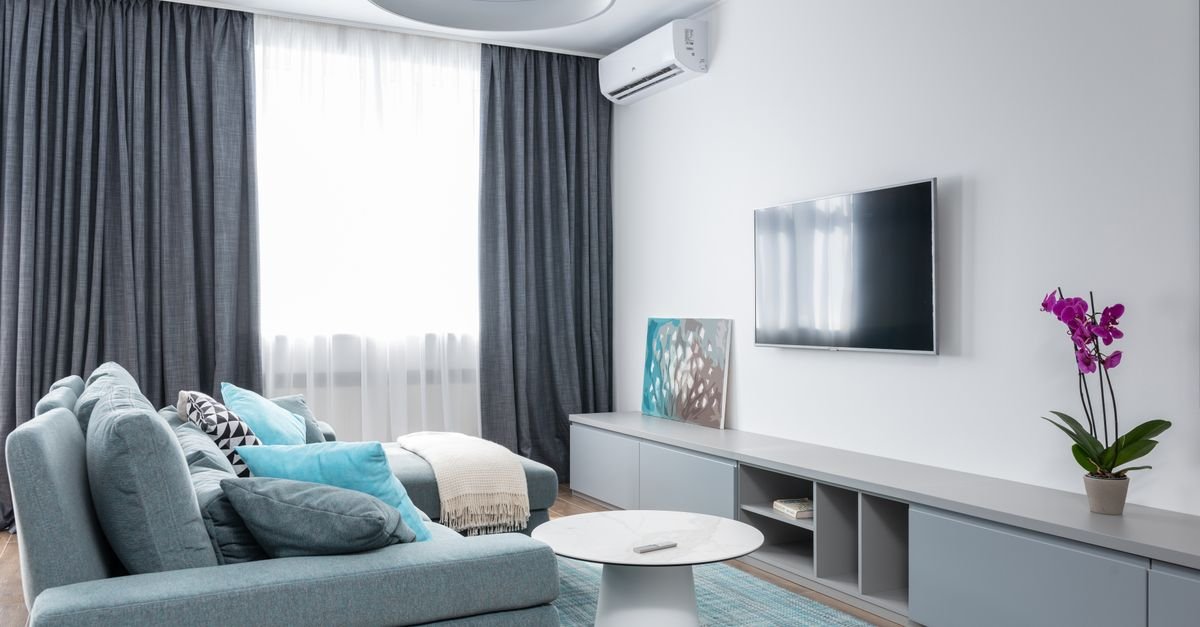 A portable air conditioner cooling a living room