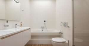 A clean modern bathroom with a bidet-ready toilet