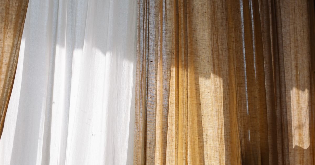 Sheer and linen curtain panels kissing the floor
