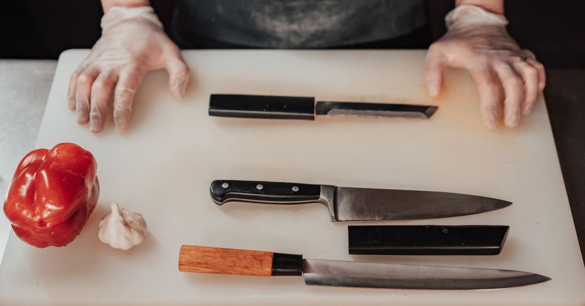 The essential kitchen knives on a board