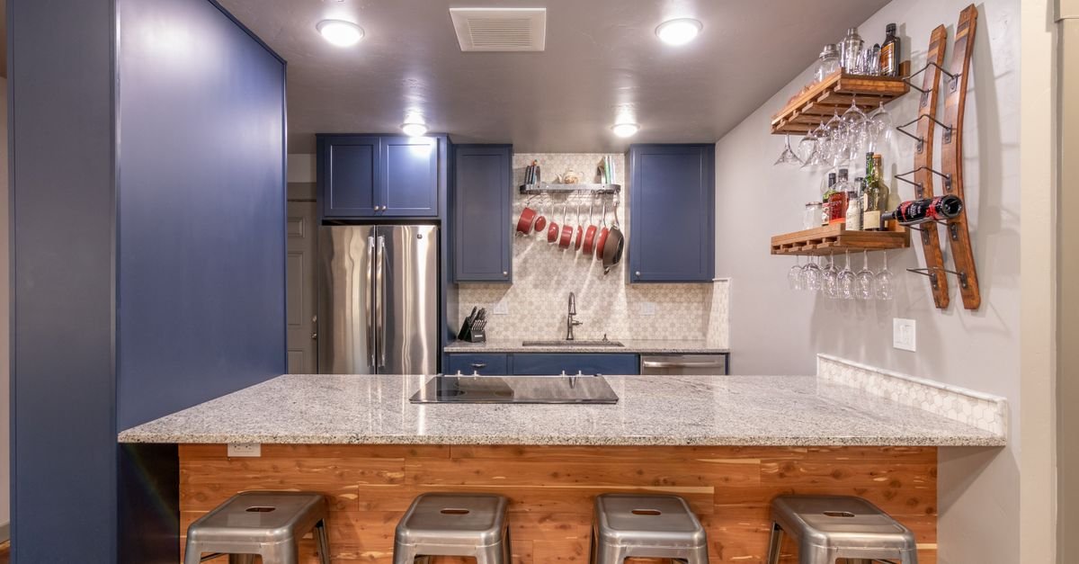 Metal bar stools at a kitchen island
