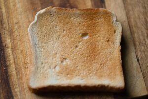 Toaster making golden toast for breakfast