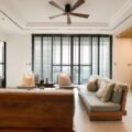 Slim tower fan cooling a bright, comfortable living room