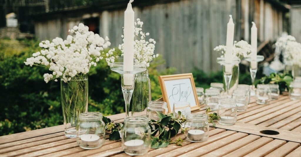 Candles on an outdoor table at dusk