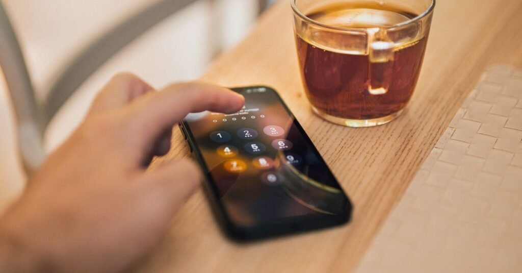 Phone beside a coffee cup running a smart home app