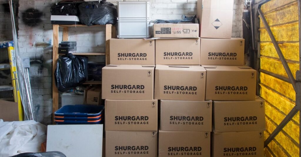 Labeled boxes stacked on garage shelving