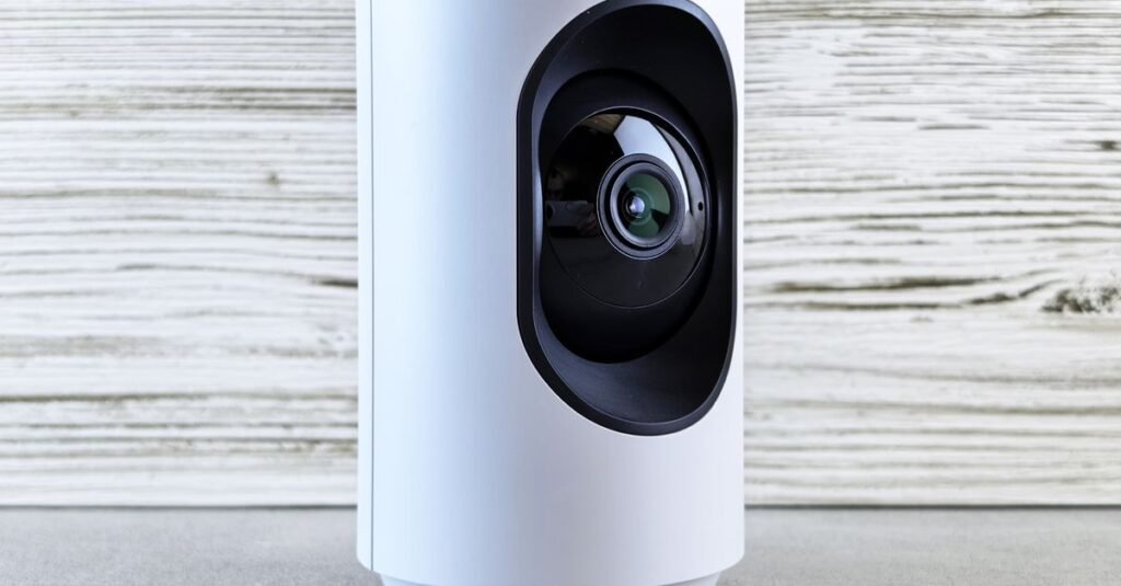 Compact white security camera on a surface