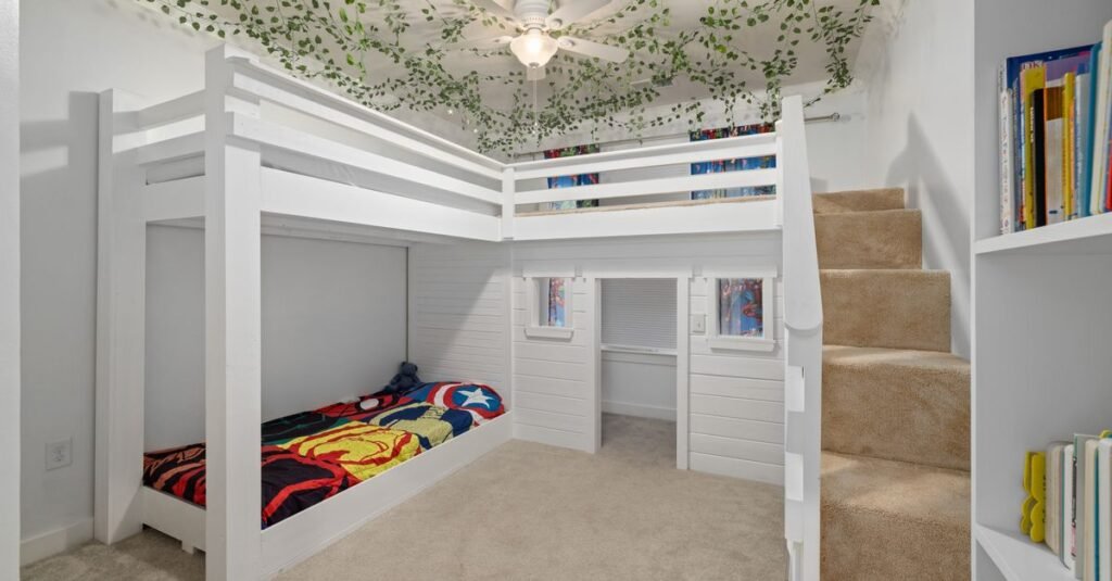 White loft bed with desk space and stairs