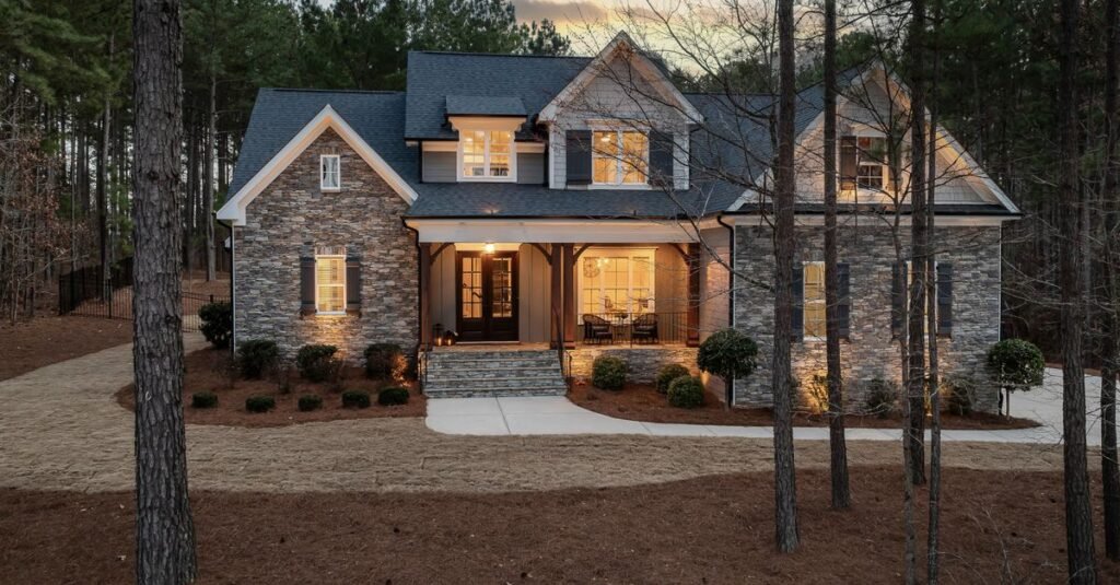 Stone house with warm exterior lighting at dusk Stone house with warm exterior lighting at dusk