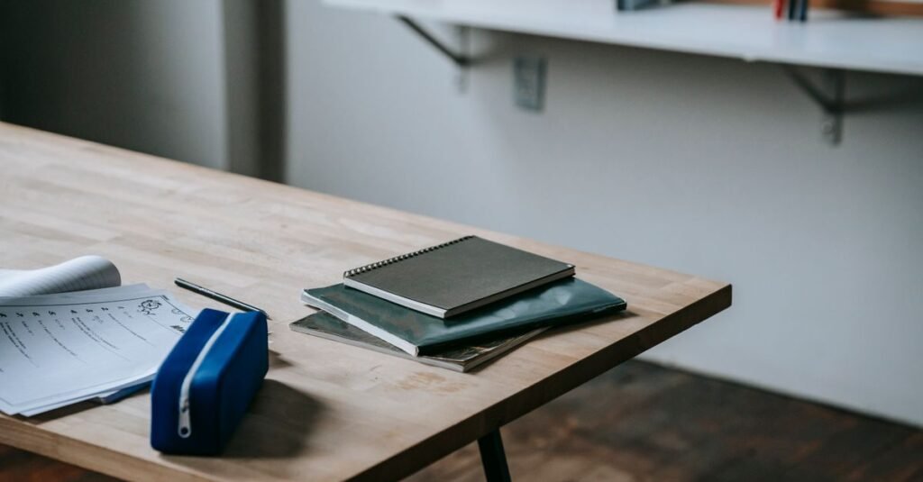 Tidy wall shelf desk with notebooks and supplies