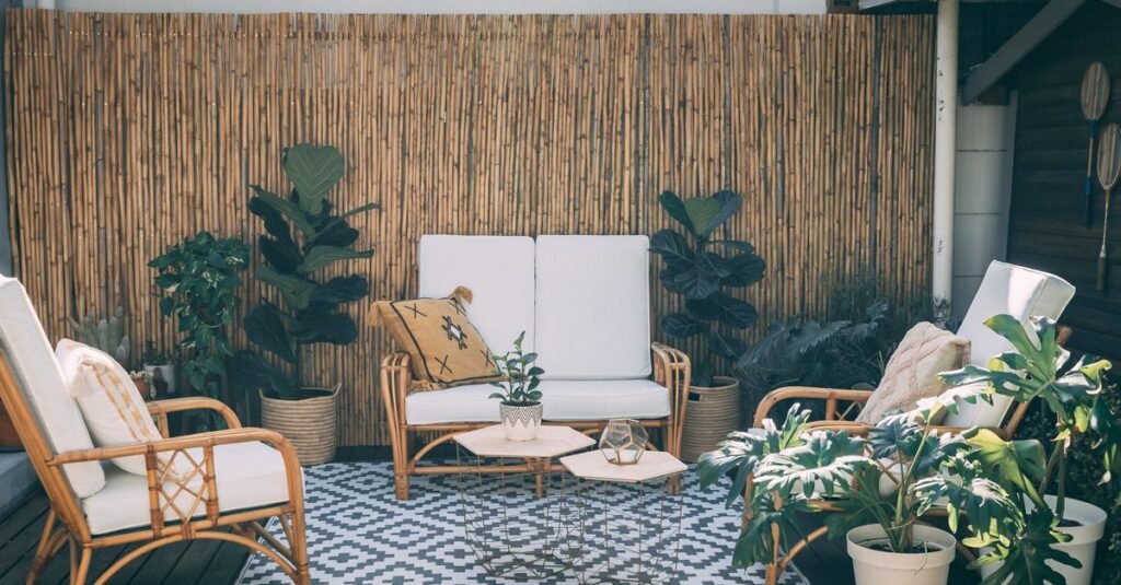 Rattan patio furniture on a blue and white patterned rug