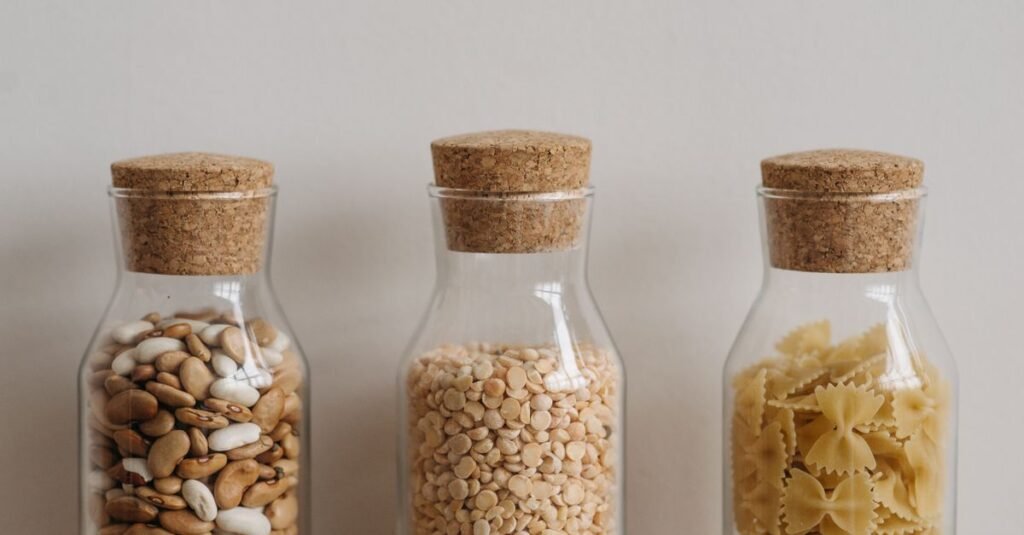 Cork-topped jars of dried pantry goods