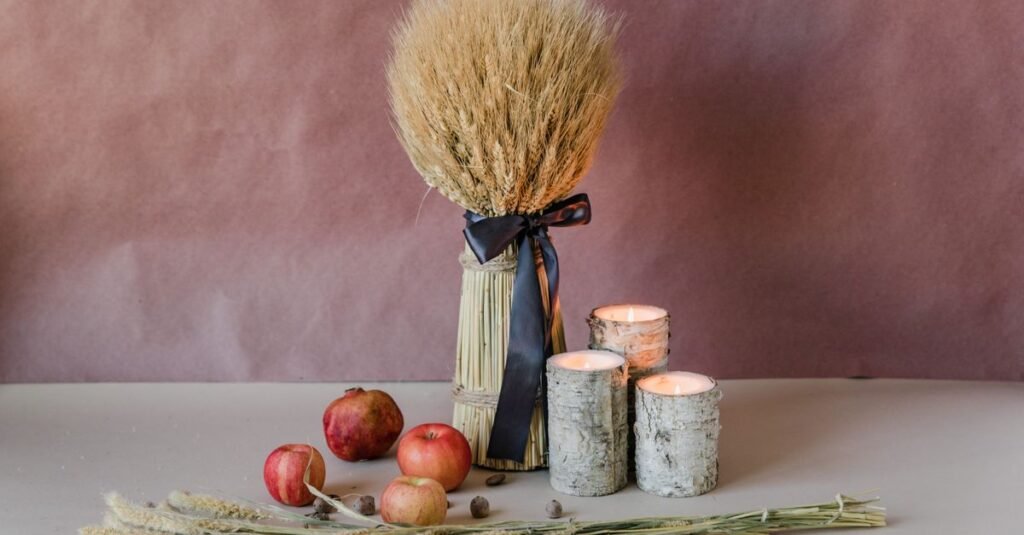 Dried wheat, candles, and apples as a centerpiece